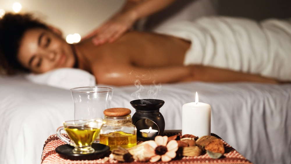 A woman enjoys a soothing aromatherapy massage