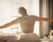 A man waking up in the morning after a good night's sleep
